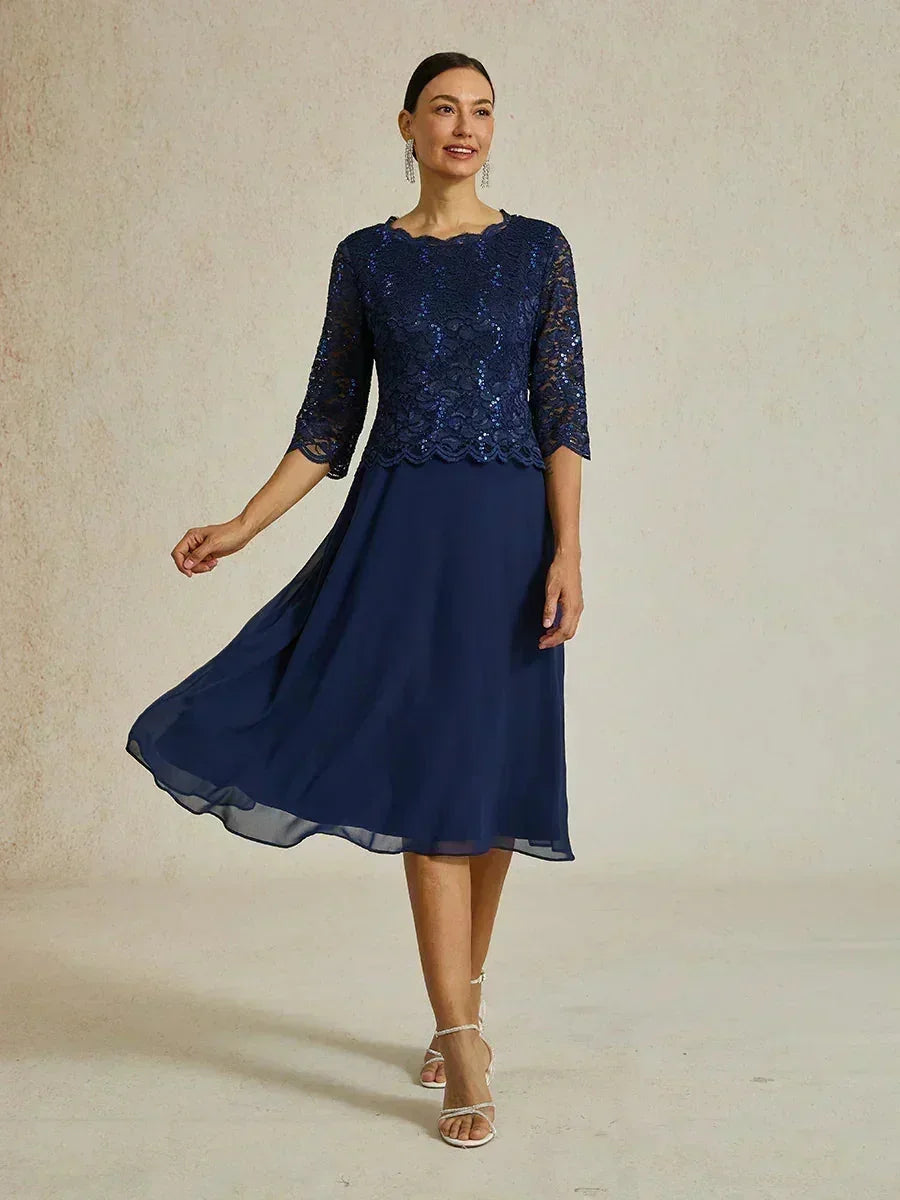 Vestido midi con encaje y manga tres cuartos